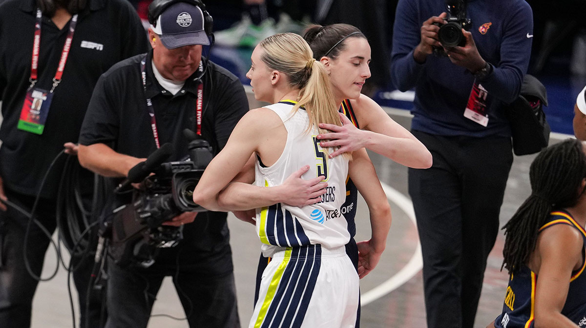 Indiana Fever guard Caitlin Clark (22) and Dallas Wings guard Paige Bueckers (5) hug Sunday, July 13, 2025, ahead of the game at Gainbridge Fieldhouse in Indianapolis.