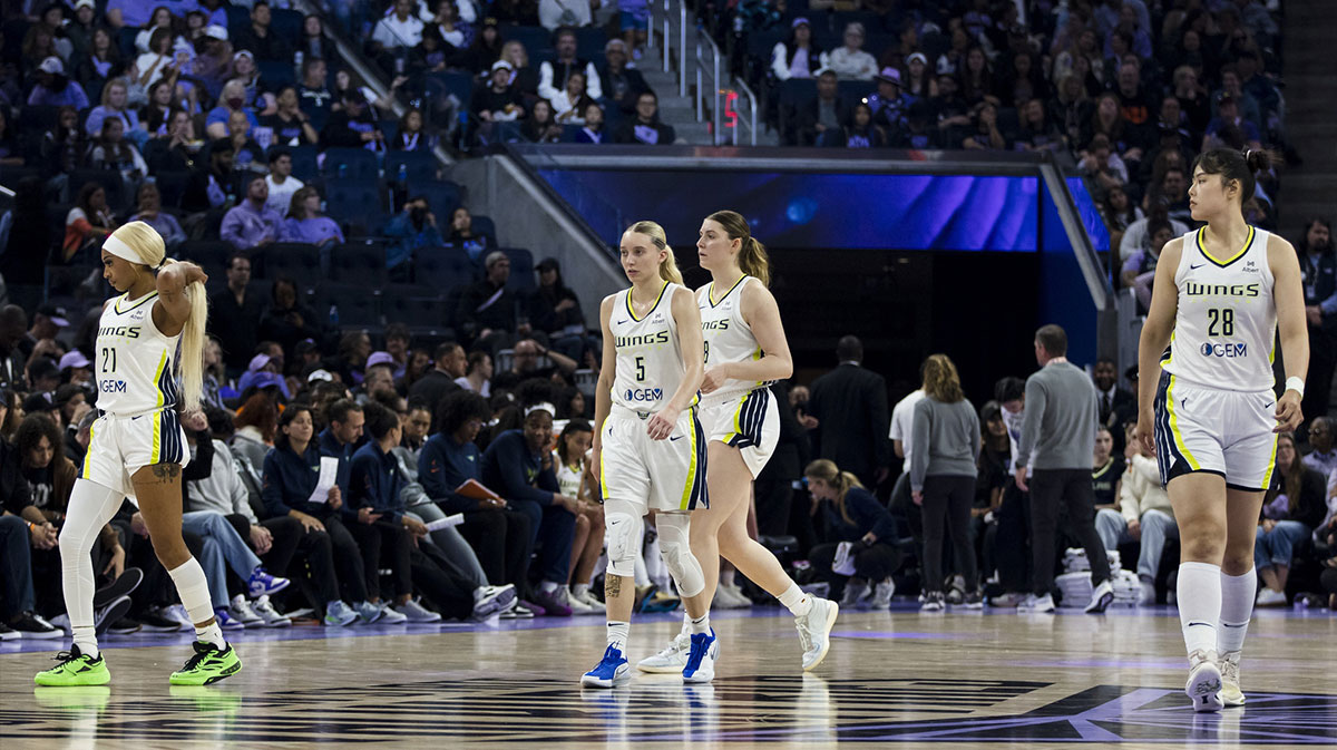Dallas Wings guard DiJonai Carrington (21), guard Paige Bueckers (5), guard Grace Berger (9) and center Li Yueru (28) walk down the court during the second quarter against the Golden State Valkyries at Chase Center.
