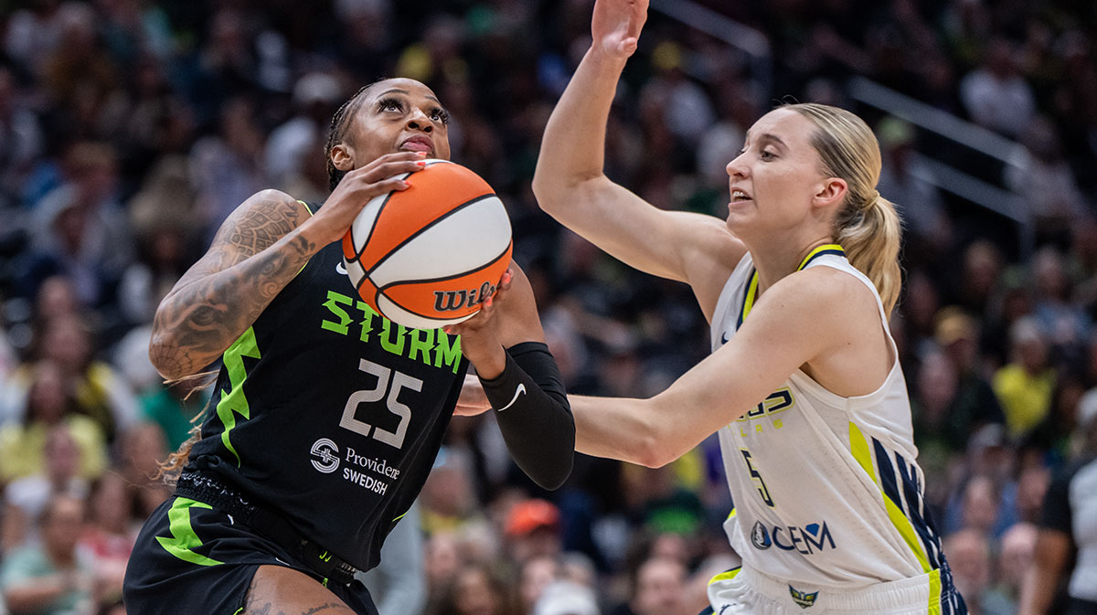 Seattle Storm guard Tiffany Mitchell shoots the ball against Dallas Wings guard Paige Bueckers (5) during the first half at Climate Pledge Arena.