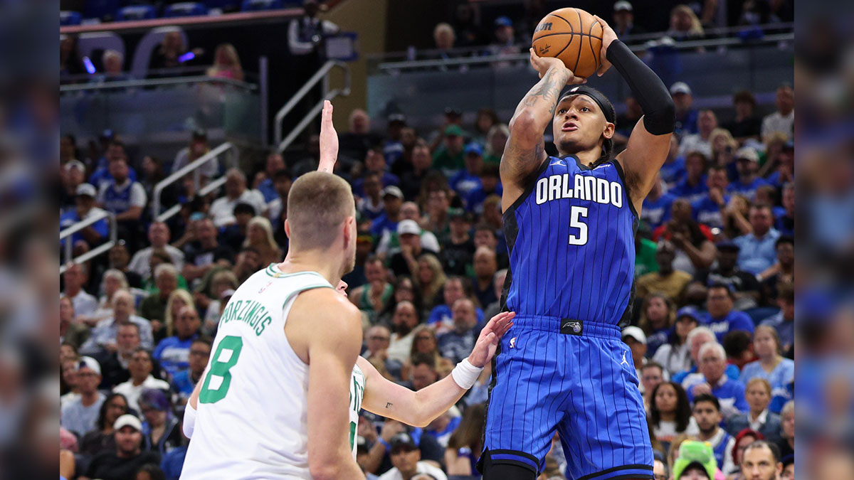 Orlando Magic forward Paolo Banchero (5) shoots the ball against the Boston Celtics in the second quarter during game four of first round for the 2025 NBA Playoffs at Kia Center.