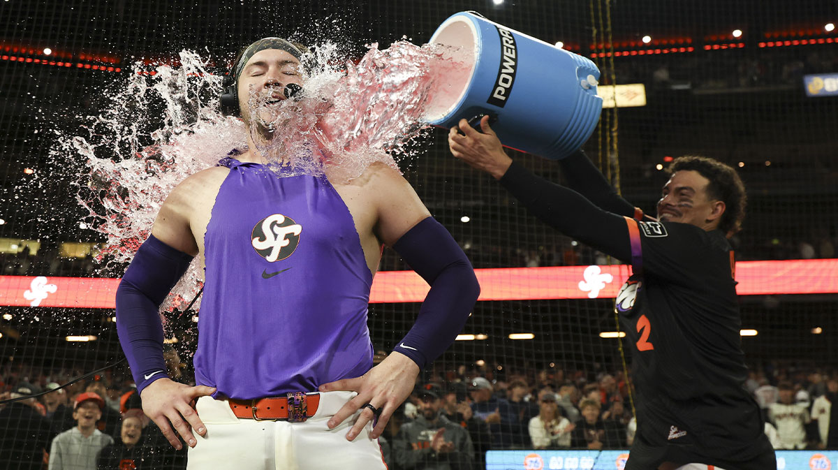 San Francisco Giants shortstop Willy Adames (2) dumps powerade on catcher Patrick Bailey (14) as Bailey is interviewed after hitting a three-run home run during the ninth inning for a walk-off win against the Philadelphia Phillies at Oracle Park.