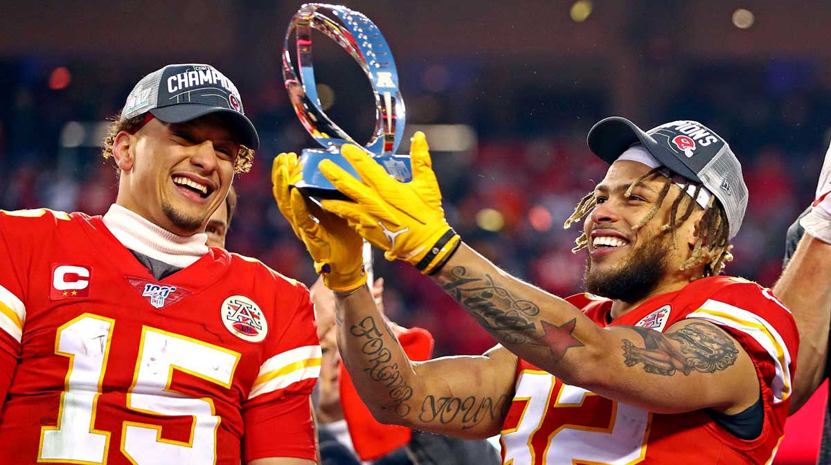 Kansas City Chiefs quarterback Patrick Mahomes (15) and strong safety Tyrann Mathieu (32) celebrate with the Lamar Hunt Trophy after beating the Tennessee Titans in the AFC Championship Game at Arrowhead Stadium.