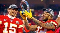 Kansas City Chiefs quarterback Patrick Mahomes (15) and strong safety Tyrann Mathieu (32) celebrate with the Lamar Hunt Trophy after beating the Tennessee Titans in the AFC Championship Game at Arrowhead Stadium.