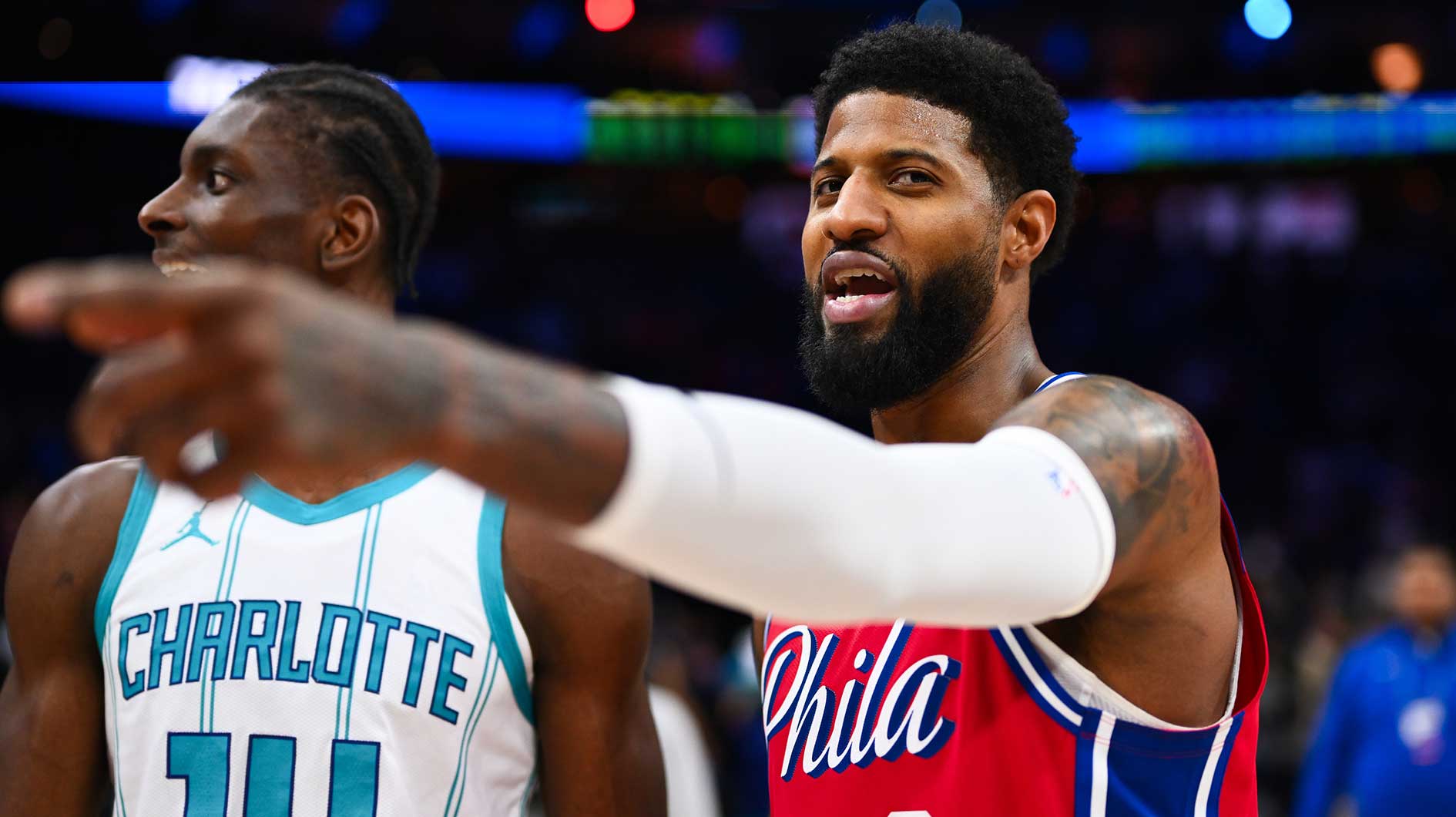 Philadelphia 76ers forward Paul George (8) reacts with Charlotte Hornets forward Moussa Diabate (14) after the game at Wells Fargo Center.
