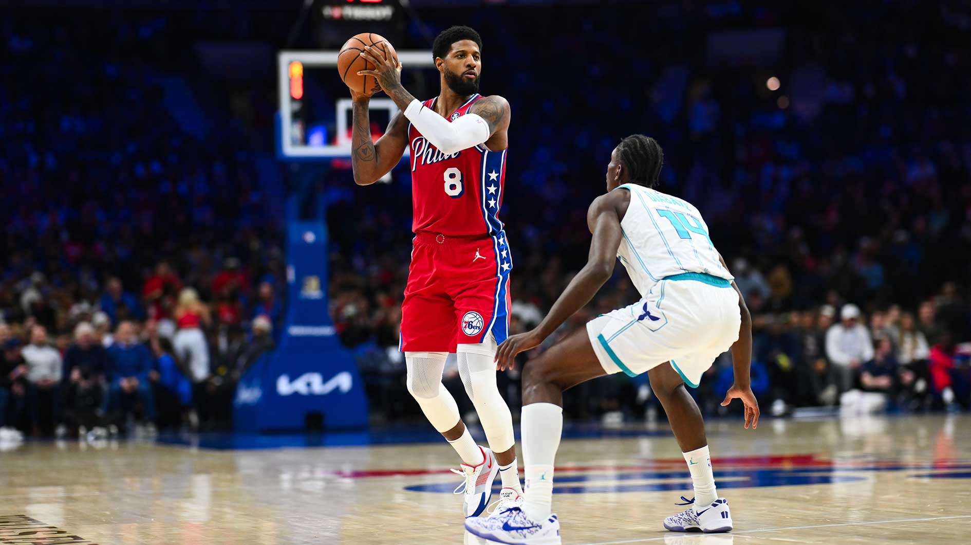 Philadelphia 76ers forward Paul George (8) controls the ball against Charlotte Hornets forward Moussa Diabate (14) in the fourth quarter at Wells Fargo Center.