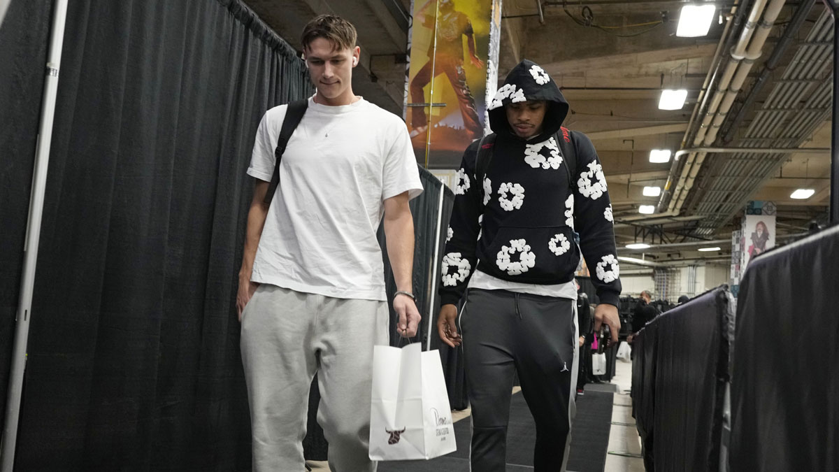 Miami Heat guard Pelle Larsson (left) and forward Keshad Johnson (right) enter Frost Bank Center before a game against the San Antonio Spurs.
