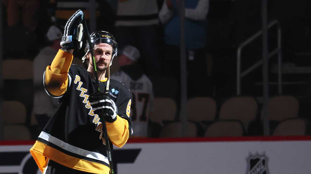 Pittsburgh Penguins defenseman Erik Karlsson (65) reacts after being named a star of the game against the Chicago Blackhawks at PPG Paints Arena.