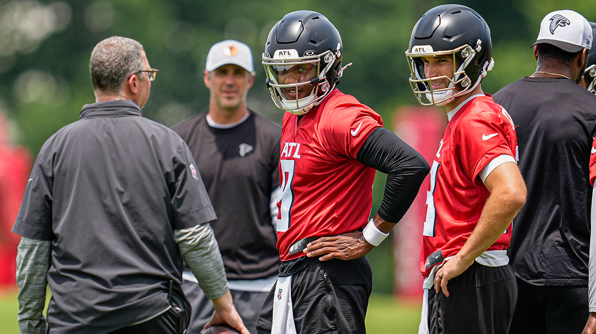 Atlanta Falcons quarterbacks Michael Penix Jr. (9) and Kirk Cousins (18)on the field during Minicamp practice at Children's Healthcare of Atlanta Training Ground.