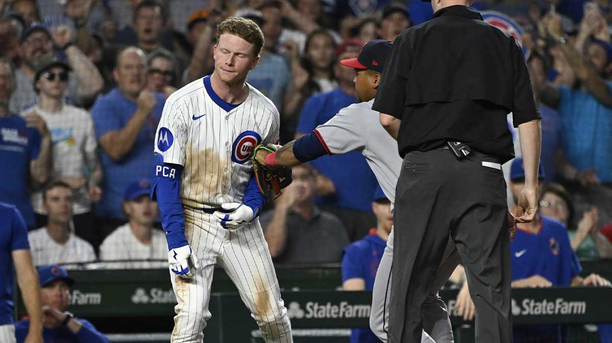 Chicago Cubs outfielder Pete Crow-Armstrong (4) os tagged out at third by Cleveland Guardians third base José Ramírez (11) during the fourth inning at Wrigley Field.