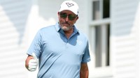 Phil Mickelson gestures to the fans at the first tee during the first round of the U.S. Open golf tournament.