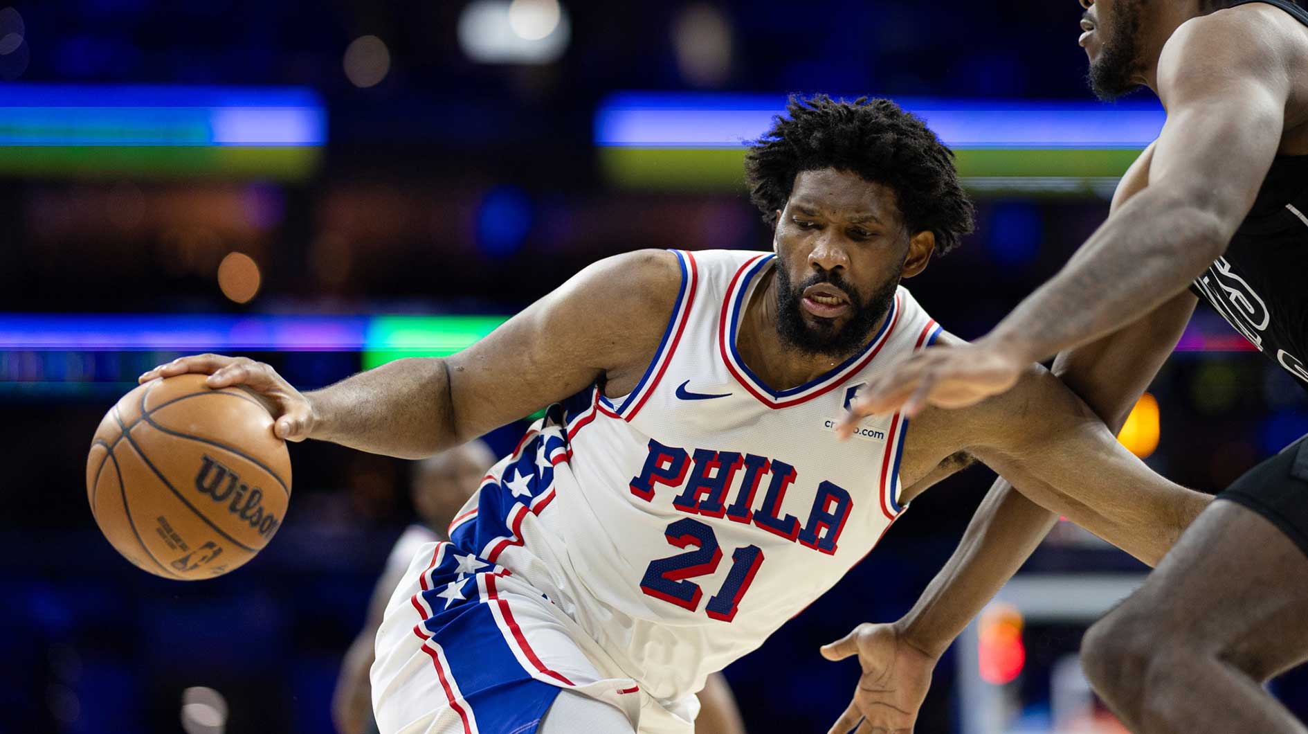 Philadelphia 76ers center Joel Embiid (21) controls the ball against Brooklyn Nets center Day'Ron Sharpe (20) during the third quarter at Wells Fargo Center.