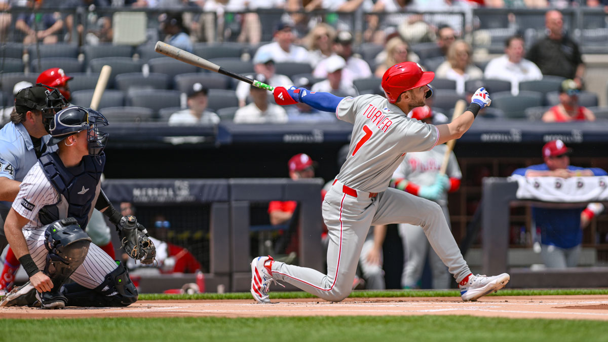 Philadelphia Phillies shortstop Trea Turner (7) hits a double against the New York Yankees during the first inning at Yankee Stadium.