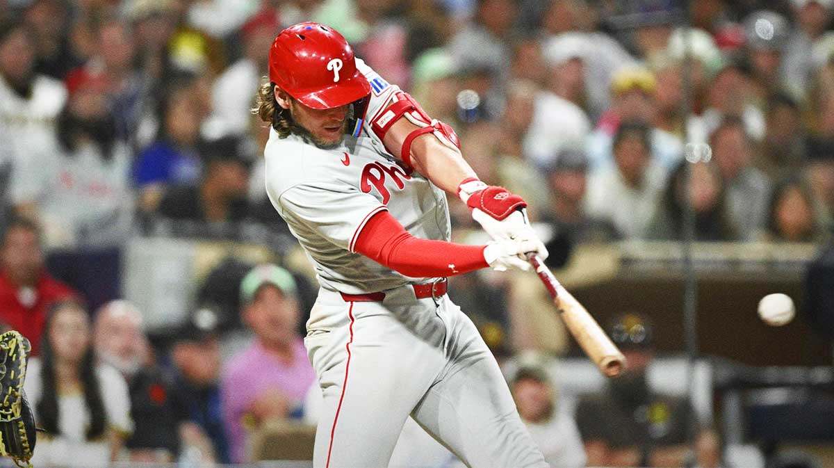 Philadelphia Phillies third baseman Alec Bohm (28) hits a single during the eighth inning against the San Diego Padres at Petco Park. 