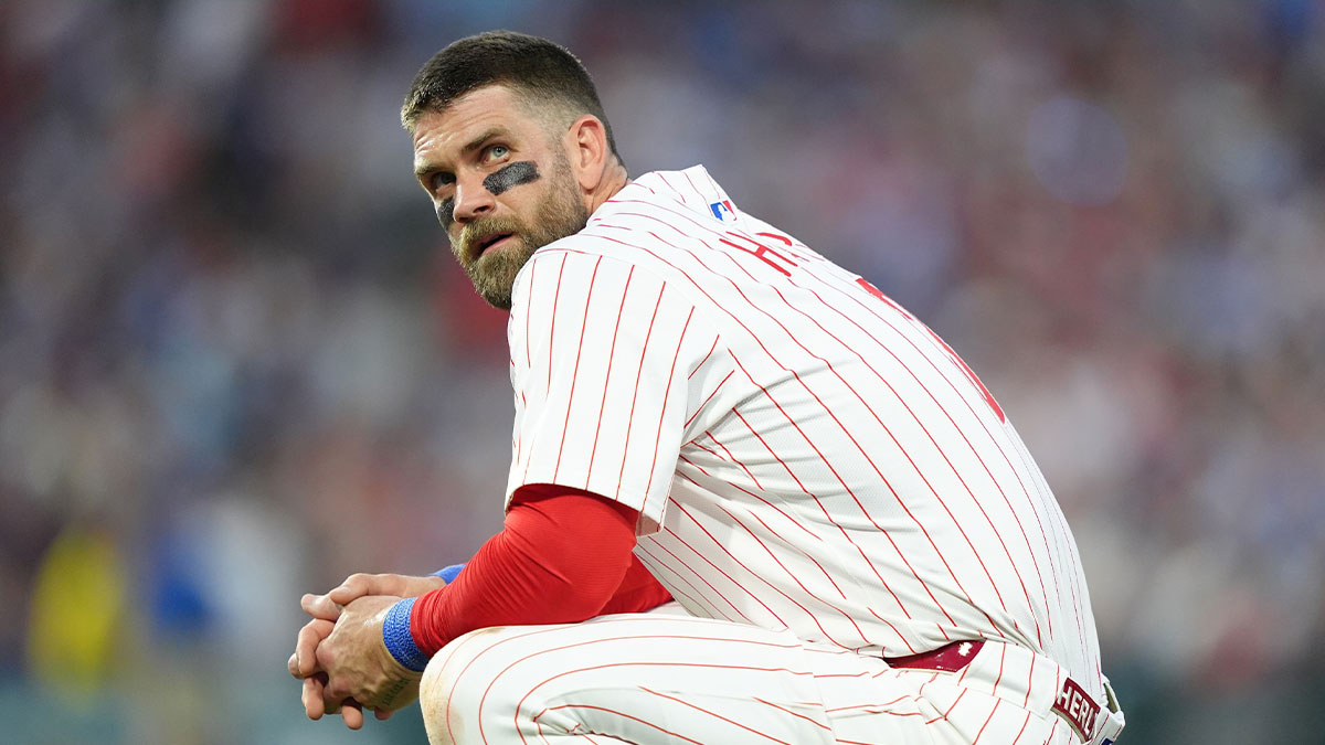 Phillies infielder Bryce Harper (3) looks on against the Boston Red Sox in the fifth inning at Citizens Bank Park with Rob Manfred in the background