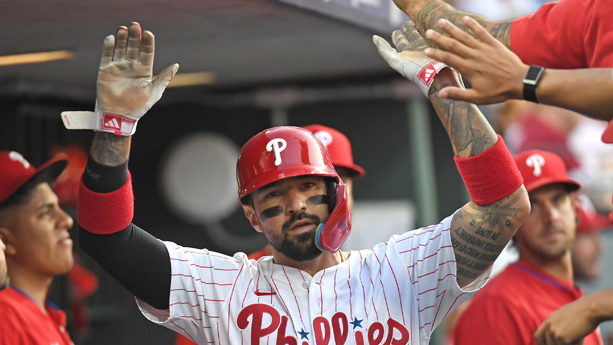 Philadelphia Phillies outfielder Nick Castellanos (8) celebrates in the dugout after scoring a run during the fourth inning against the Boston Red Sox at Citizens Bank Park.