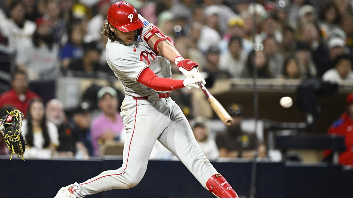 Philadelphia Phillies third baseman Alec Bohm (28) hits a single during the eighth inning against the San Diego Padres at Petco Park.