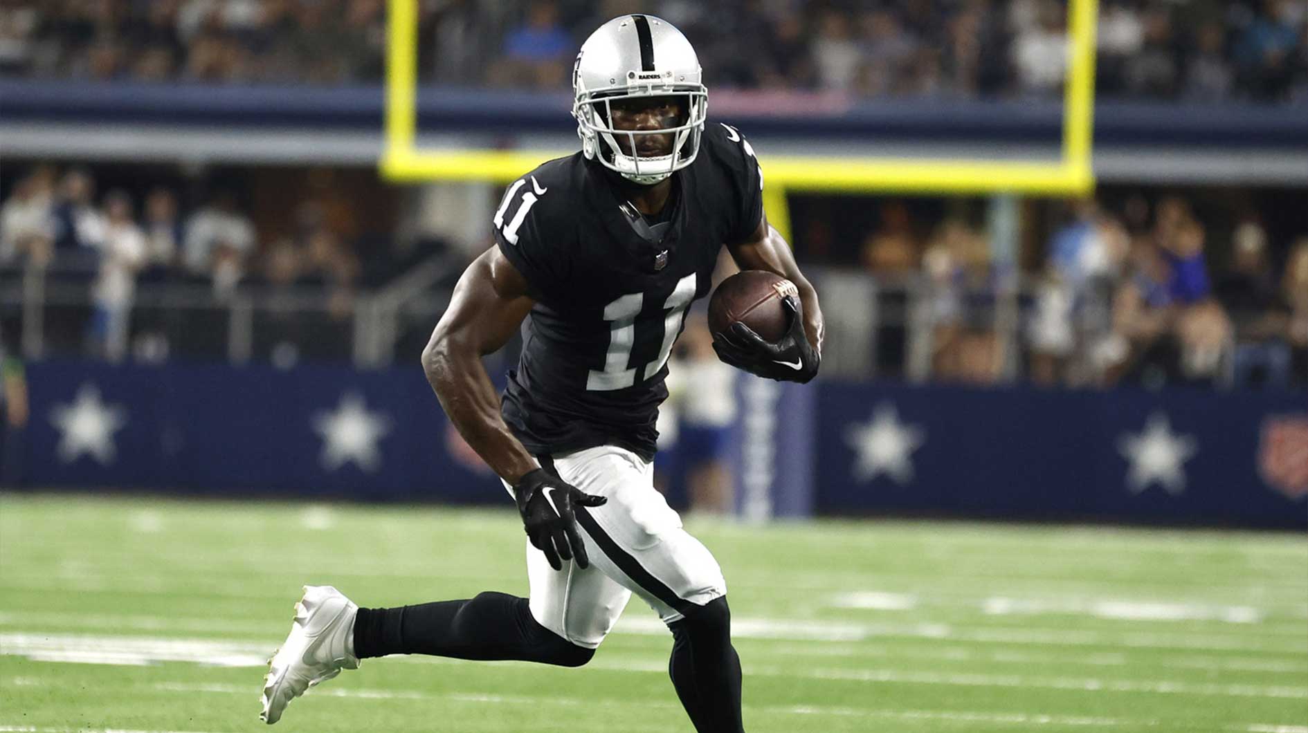 Las Vegas Raiders wide receiver Phillip Dorsett (11) runs the ball in the fourth quarter against the Dallas Cowboys