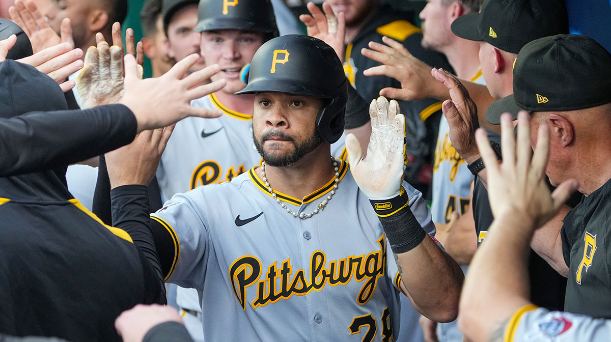 Pittsburgh Pirates left fielder Tommy Pham (28) celebrates in the dugout after hitting a two run home run against the Kansas City Royals during the second inning at Kauffman Stadium.