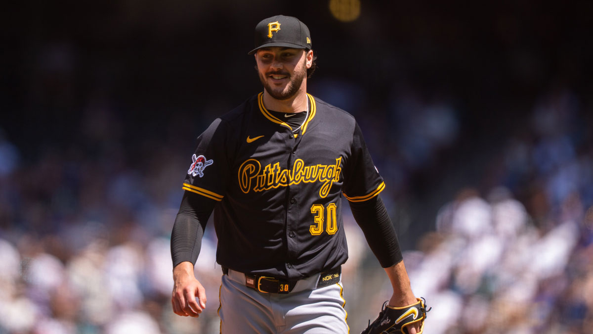 Pittsburgh Pirates starting pitcher Paul Skenes (30) smiles as he walks off the field during the third inning at T-Mobile Park.