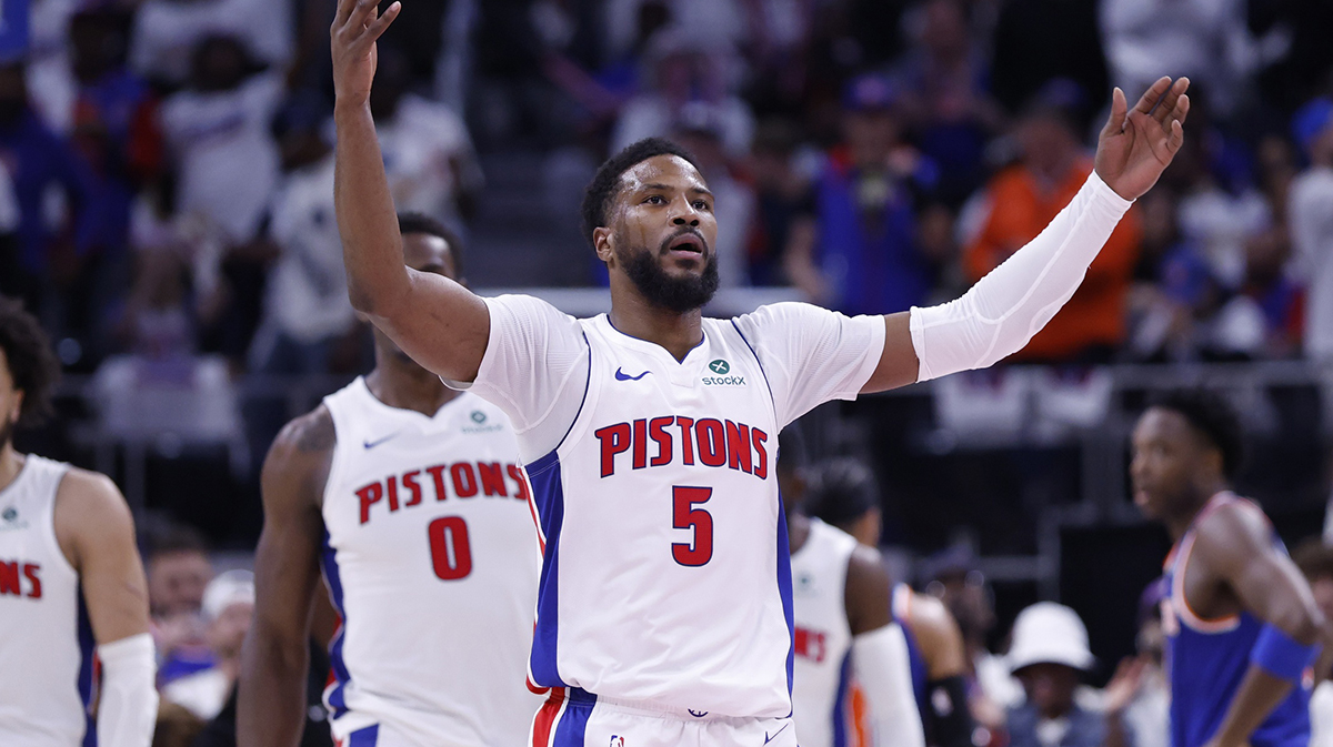Pistons guard Malik Beasley (5) fires up the crowd in the first half against the New York Knicks during game six of first round for the 2024 NBA Playoffs at Little Caesars Arena with ESPN's Kendrick Perkins in the background