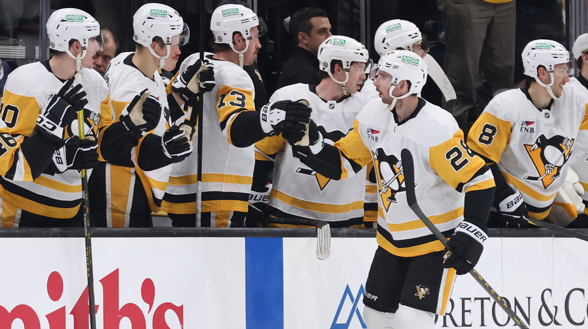 Pittsburgh Penguins defenseman Marcus Pettersson (28) celebrates a goal against the Utah Hockey Club with the bench players during the second period at Delta Center.