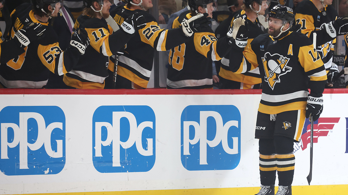 Pittsburgh Penguins right wing Bryan Rust (17) celebrates his goal with the Penguins bench against the Washington Capitals during the first period at PPG Paints Arena.