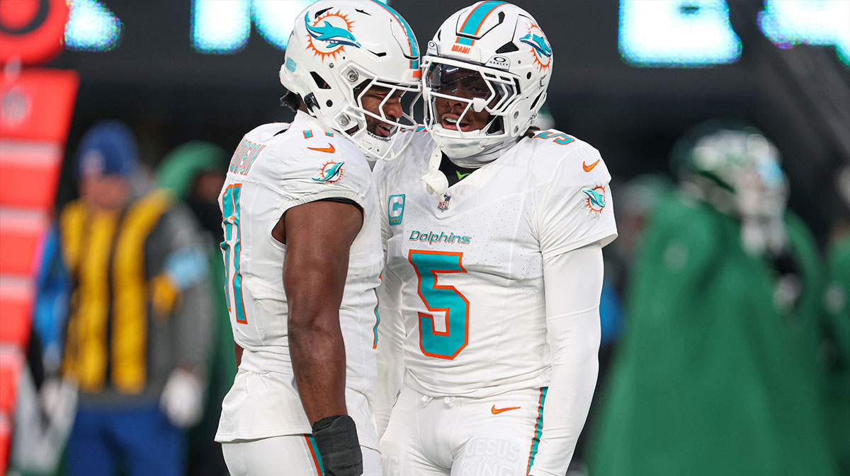 Miami Dolphins cornerback Jalen Ramsey (5) celebrates a defensive stop with linebacker Tyrel Dodson (11) during the first quarteragainst the New York Jets at MetLife Stadium.