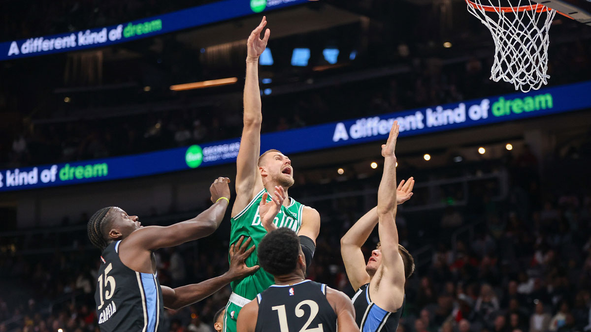 Boston Celtics center Kristaps Porzingis (8) shoots against the Atlanta Hawks in the first quarter at State Farm Arena.