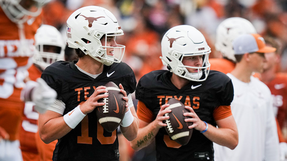 Texas Longhorns quarterbacks Arch Manning (16), left, and Quinn Ewers (3) throw passes while warming up ahead of the Longhorns' spring Orange and White game at Darrell K Royal Texas Memorial Stadium.
