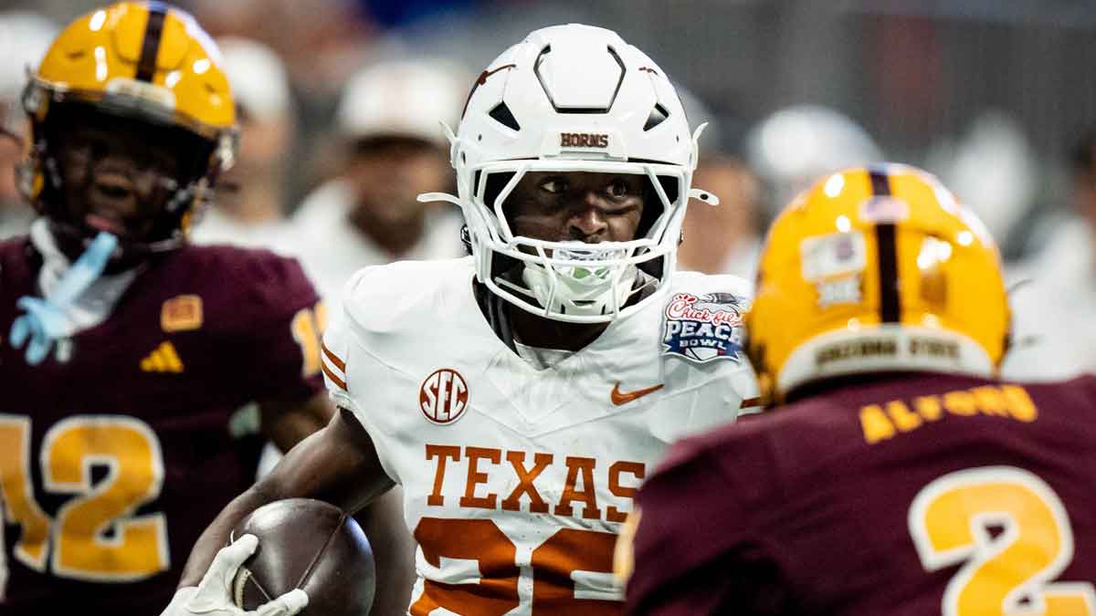 Texas Longhorns running back Quintrevion Wisner (26) runs the ball in the second quarter as the Texas Longhorns play the Arizona State Sun Devils in the Peach Bowl College Football Playoff quarterfinal at Mercedes-Benz Stadium in Atlanta, Georgia, Jan. 1, 2025.