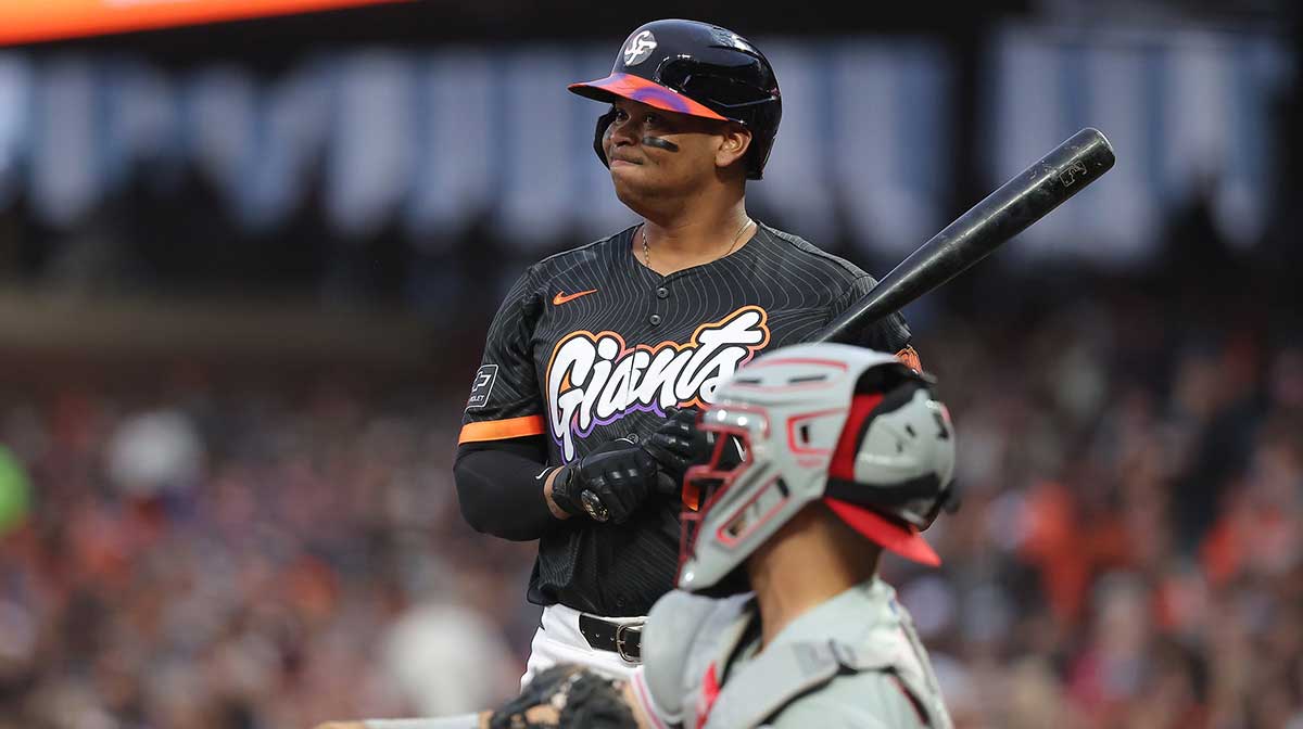 San Francisco Giants designated hitter Rafael Devers (16) reacts after a pitch ahead of Philadelphia Phillies catcher Rafael Marchan (13) during the fifth inning at Oracle Park.