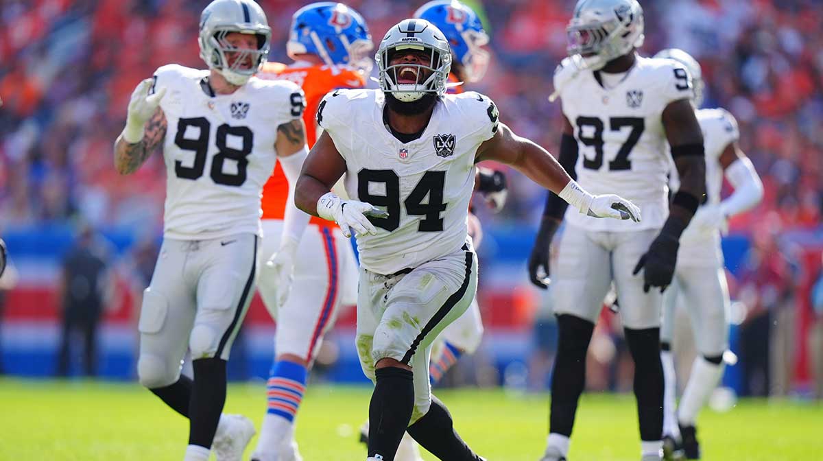 Las Vegas Raiders defensive tackle Christian Wilkins (94) celebrates his sack in the second quarter against the Denver Broncos at Empower Field at Mile High.
