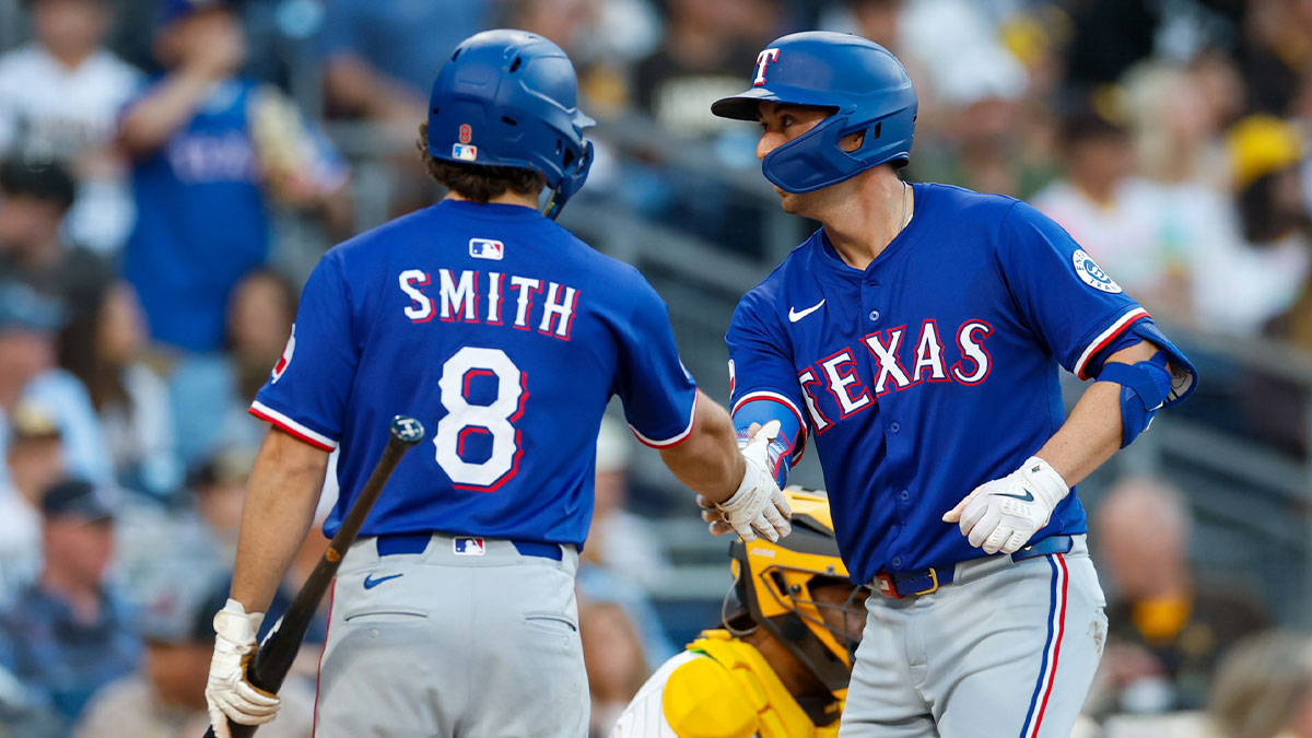 Texas Rangers third baseman Josh Smith (8) throws to first base for an out during the second inning against the San Diego Padres at Petco Park.