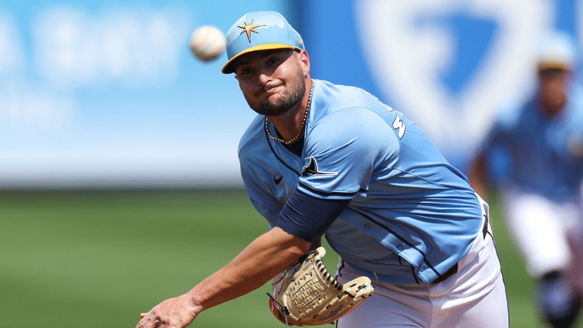 Tampa Bay Rays pitcher Shane McClanahan (18) throws a pitch against the New York Mets in the second inning during spring training at Charlotte Sports Park.