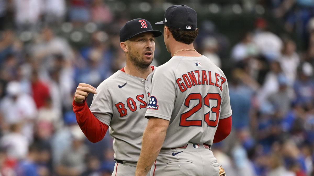 Red Sox third baseman Alex Bregman (2) and first baseman Romy Gonzalez (23) react after the game against the Chicago Cubs at Wrigley Field