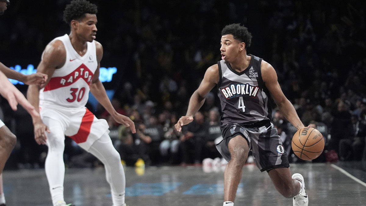 Brooklyn Nets guard Reece Beekman (4) dribbles the ball against Toronto Raptors guard Ochai Agbaji (30) during the second half at Barclays Center.
