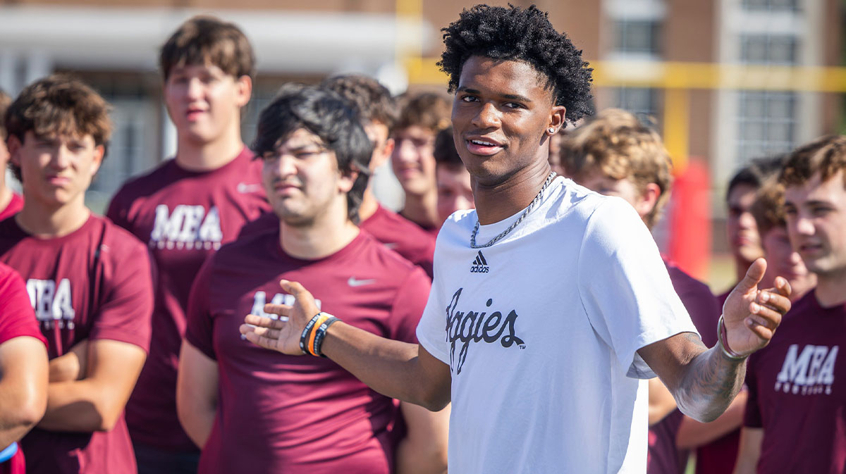 Former MBA quarterback and current Texas A&M starter Marcel Reed speaks at the start of a kids’ football camp held at MBA Saturday, July 12, 2025.