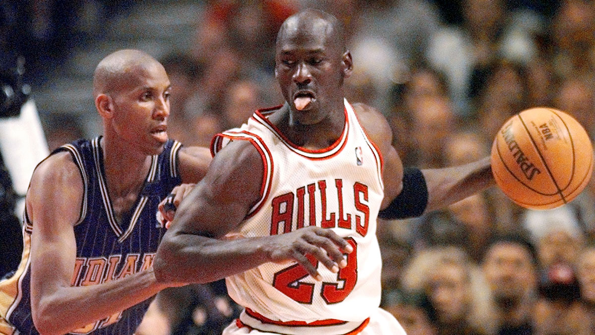 Chicago Bulls guard Michael Jordan (23), right, is guarded by Indiana Pacers player Reggie Miller (31) in the second half at the United Center.