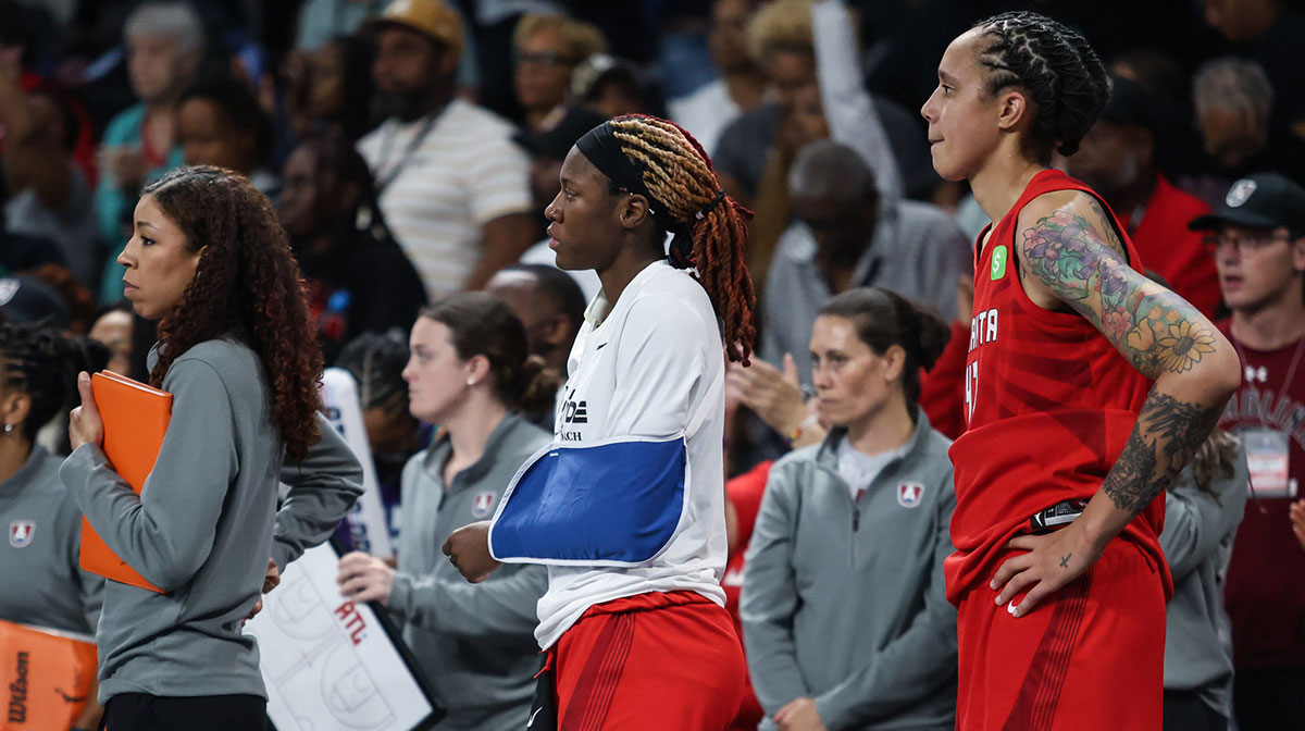 Atlanta Dream guard Rhyne Howard (10) and center Brittney Griner (42) during the third watch the game from the bench during the game against New York Liberty during the third quarter at Gateway Center Arena at College Park.