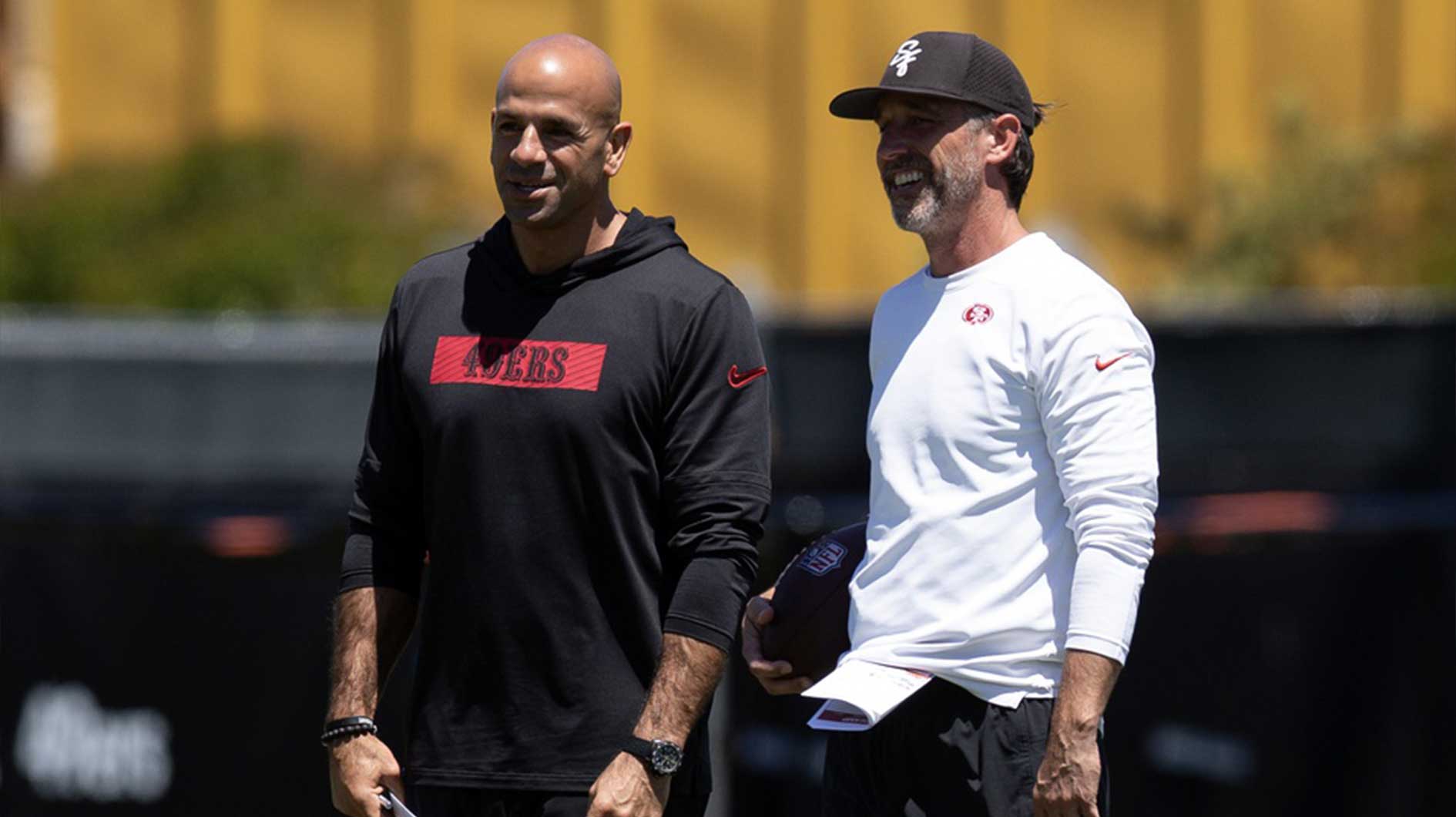 San Francisco 49ers head coach Kyle Shanahan, right, confers with defensive coordinator Robert Saleh during the teamís rookie minicamp.