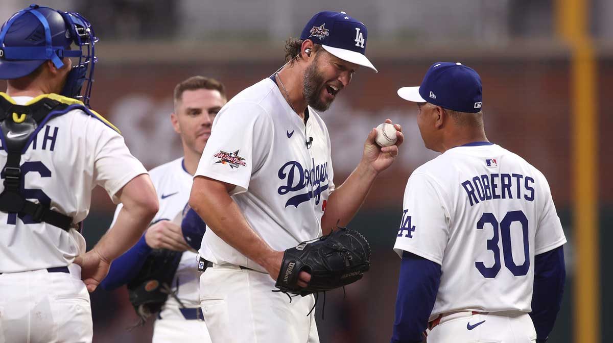 National League pitcher Clayton Kershaw (22) of the Los Angeles Dodgers reacts with manager Dave Roberts of the Los Angeles Dodgers in the second inning against the American League during the 2025 MLB All Star Game at Truist Park