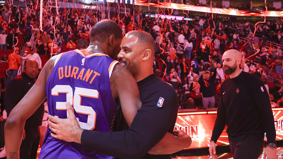 Suns forward Kevin Durant (35) hugs Houston Rockets head coach Ime Udoka after a game at Toyota Center