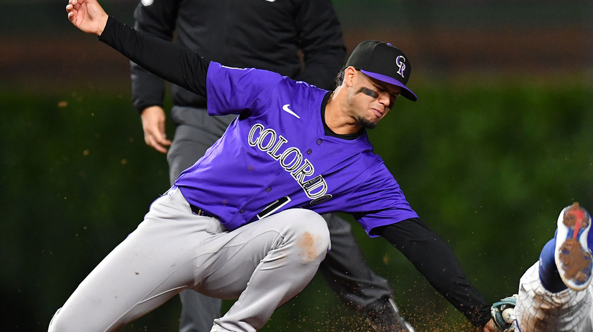 Colorado Rockies shortstop Ezequiel Tovar (14) tags out Chicago Cubs shortstop Dansby Swanson (7) while attempting to steal during the eighth inning at Wrigley Field. Ritter
