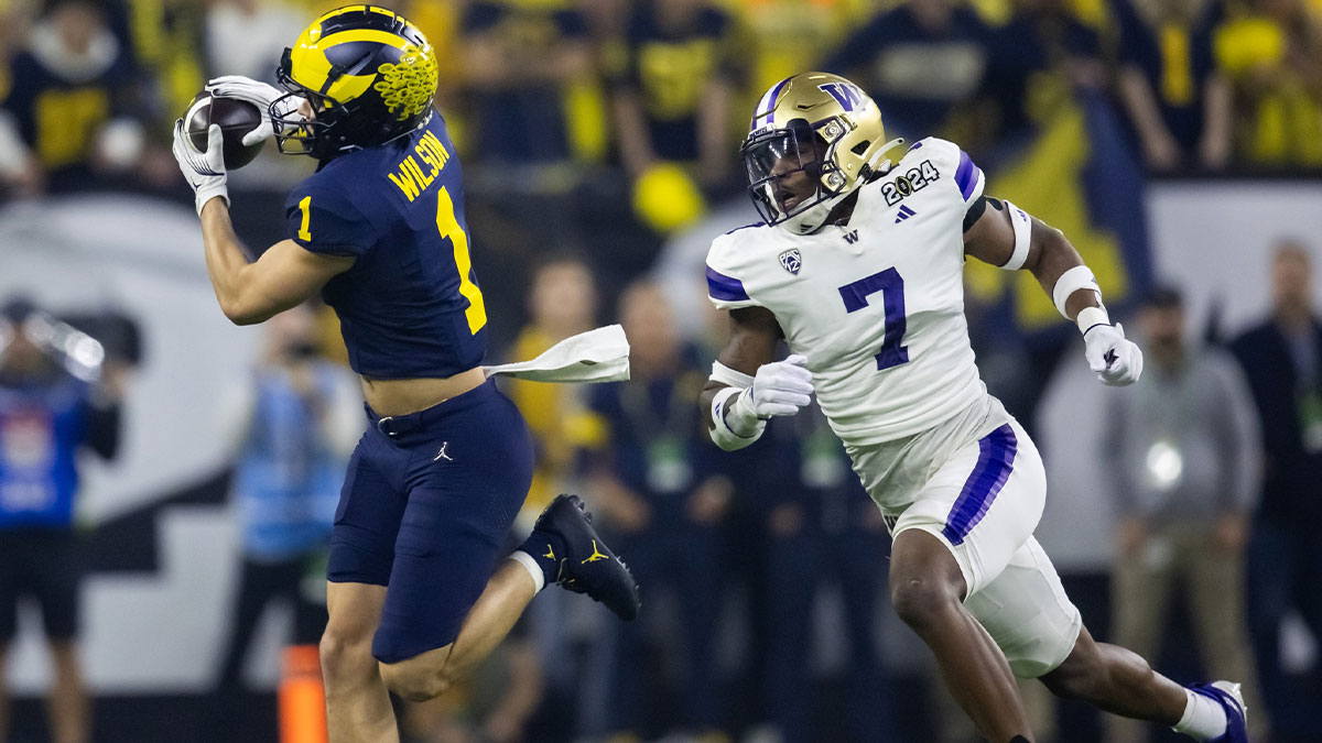 Michigan Wolverines wide receiver Roman Wilson (1) against Washington Huskies defensive back Dominique Hampton (7) during the 2024 College Football Playoff national championship game at NRG Stadium.