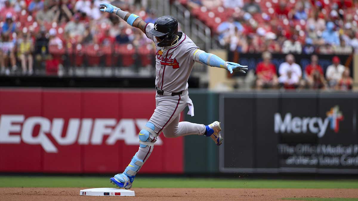 Atlanta Braves right fielder Ronald Acuna Jr (13) reacts as he runs the bases after hitting a solo home run against the St. Louis Cardinals during the first inning at Busch Stadium.