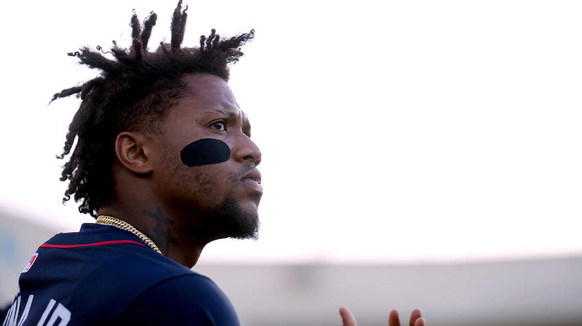 Atlanta Braves right fielder Ronald Acuna Jr. (13) kneels in the dugout before the start of the game against the Athletics at Sutter Health Park.
