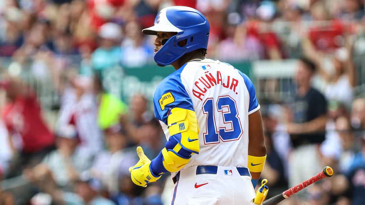 Jun 14, 2025; Cumberland, Georgia, USA; Atlanta Braves outfielder Ronald Acuna Jr. (13) watches the ball after hitting a home run against the Colorado Rockies during the second inning at Truist Park. Mandatory Credit: Jordan Godfree-Imagn Images