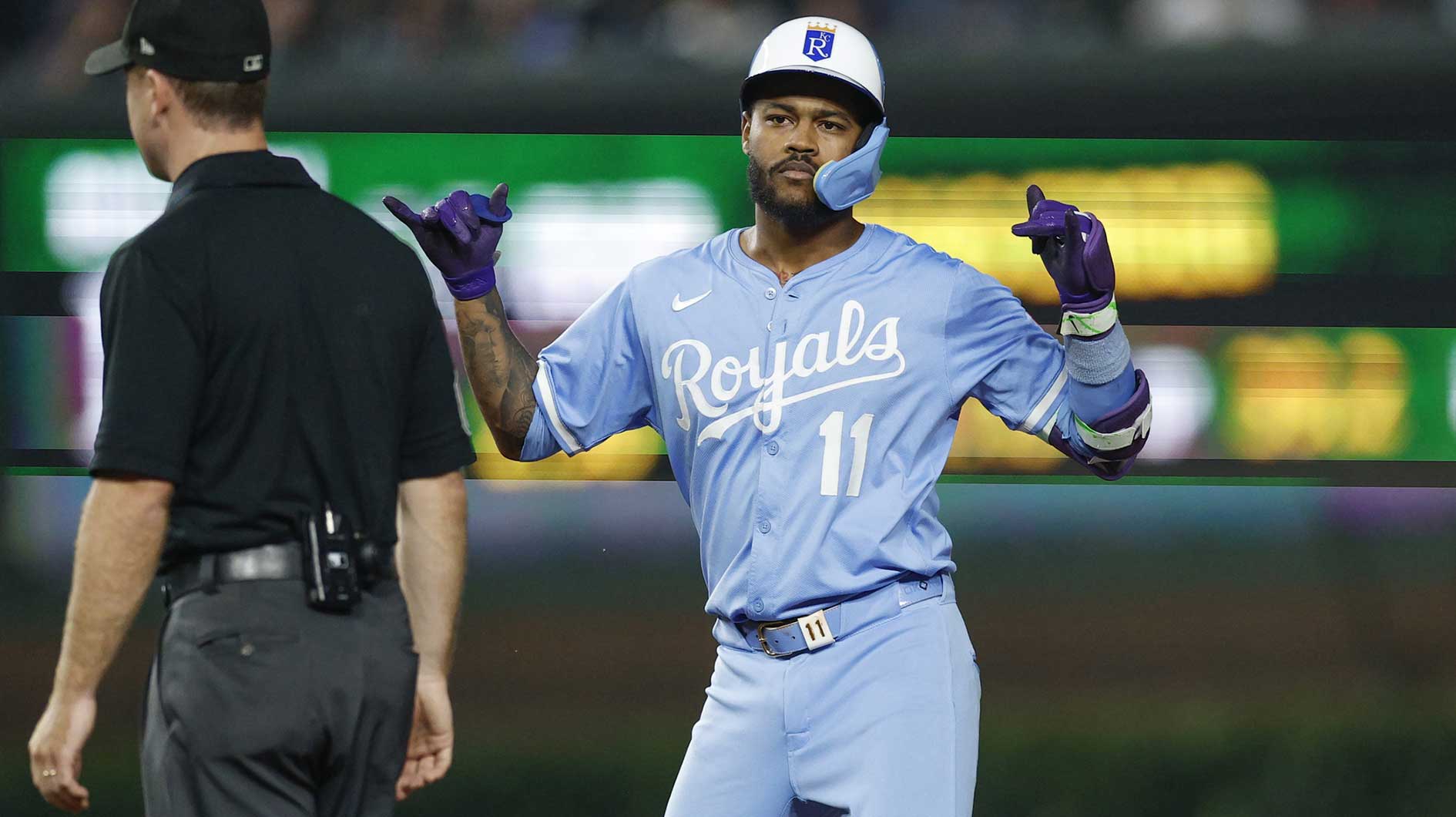 Kansas City Royals third baseman Maikel Garcia (11) celebrates after hitting a double against the Chicago Cubs during the eight inning at Wrigley Field.