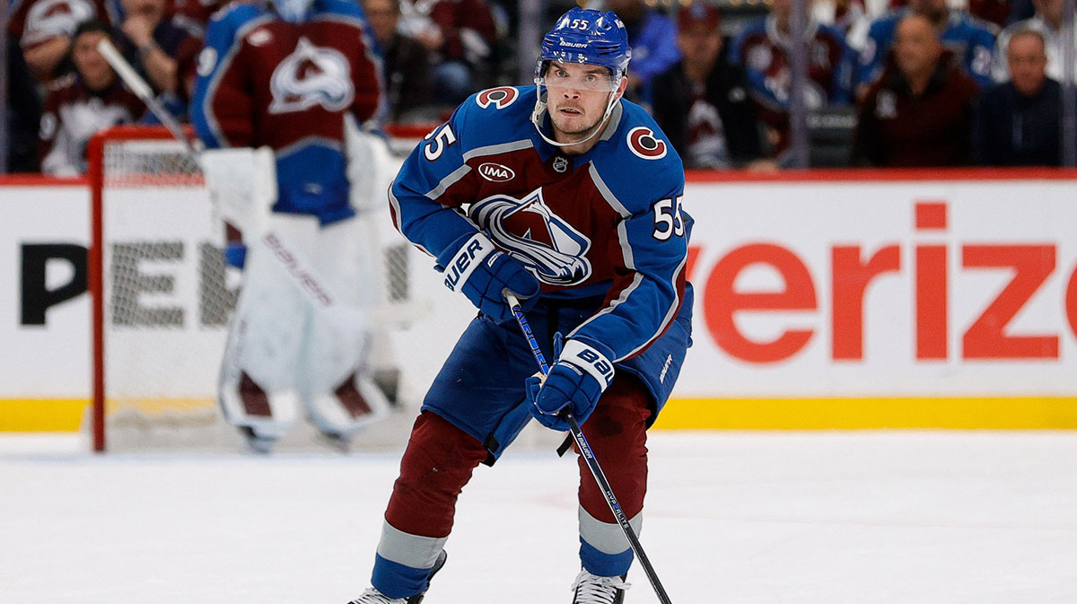 Colorado Avalanche defenseman Ryan Lindgren (55) controls the puck in the second period against the Dallas Stars in game three of the first round of the 2025 Stanley Cup Playoffs at Ball Arena.