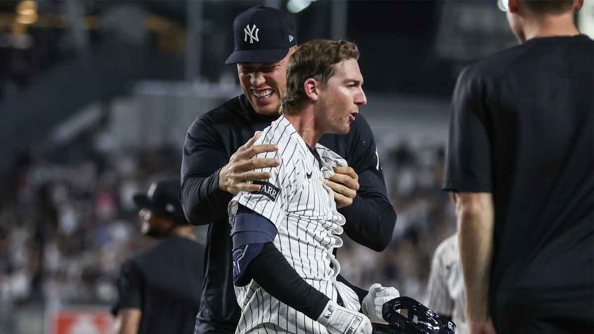 New York Yankees third baseman Ryan McMahon (19) celebrates with outfielder Aaron Judge (99) after hitting a game winning RBI single in the eleventh inning to defeat the Tampa Bay Rays 5-4 at Yankee Stadium.